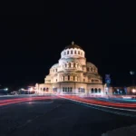 lighted cathedral at night by the road