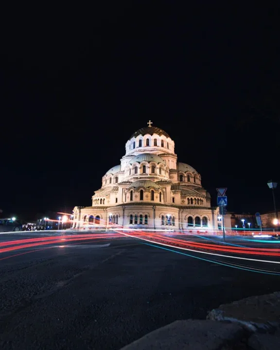 lighted cathedral at night by the road