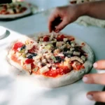 person showing pizza