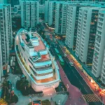 white boat building surrounded with high-rise buildings