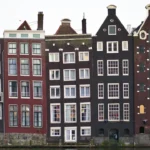 assorted-color houses under white sky