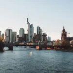 a city skyline with a river