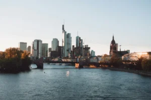 a city skyline with a river